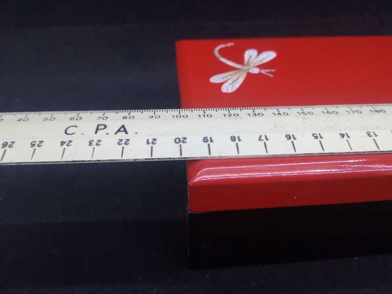 Vintage red lacquer jewelry box with dragonfly detail