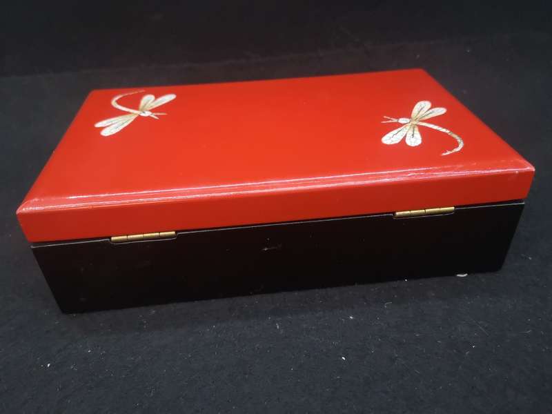 Vintage red lacquer jewelry box with dragonfly detail