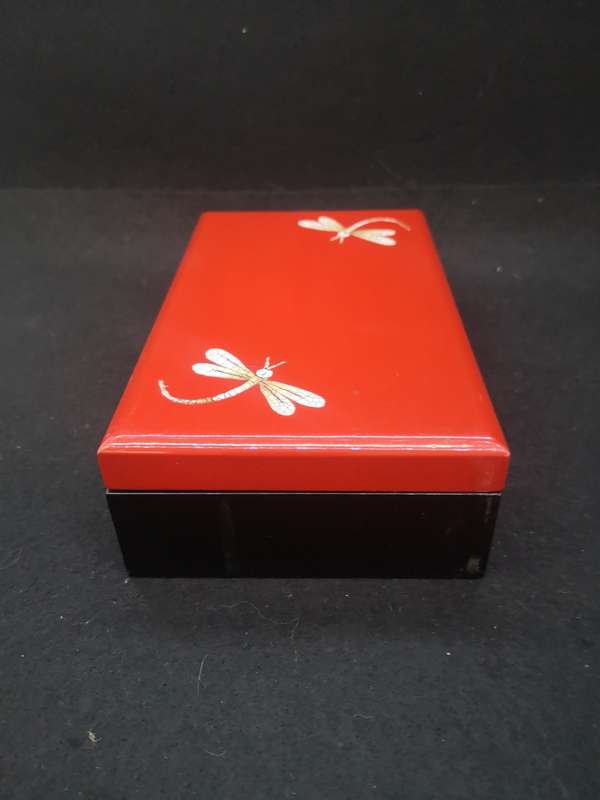 Vintage red lacquer jewelry box with dragonfly detail