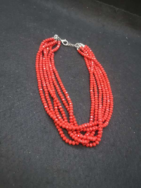 Six strand red glass necklace
