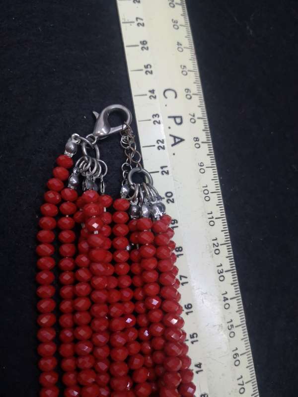 Six strand red glass necklace