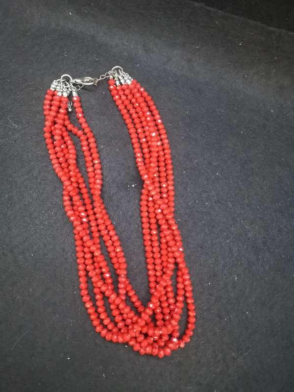 Six strand red glass necklace