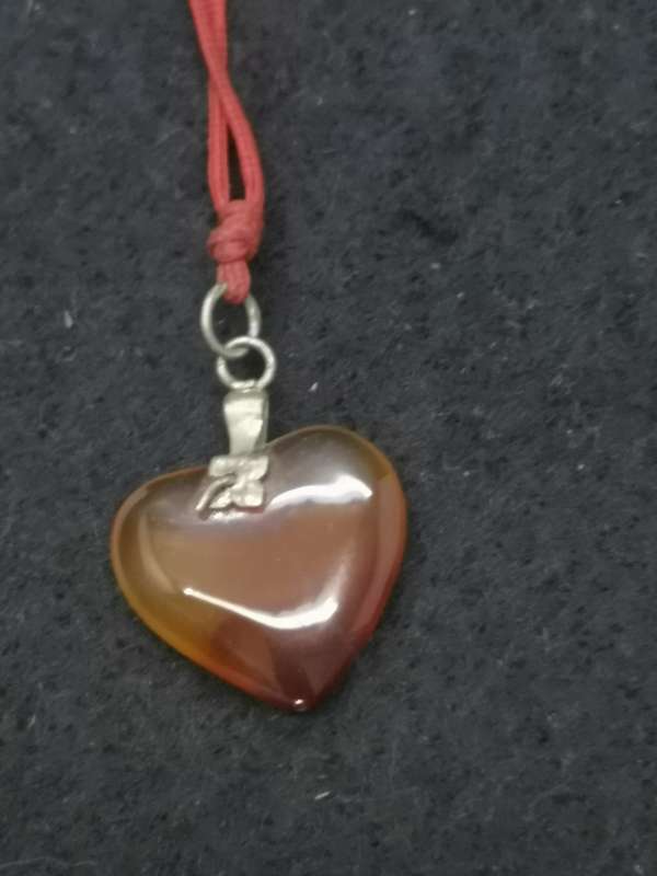 Semi-precious stone heart pendant on a string
