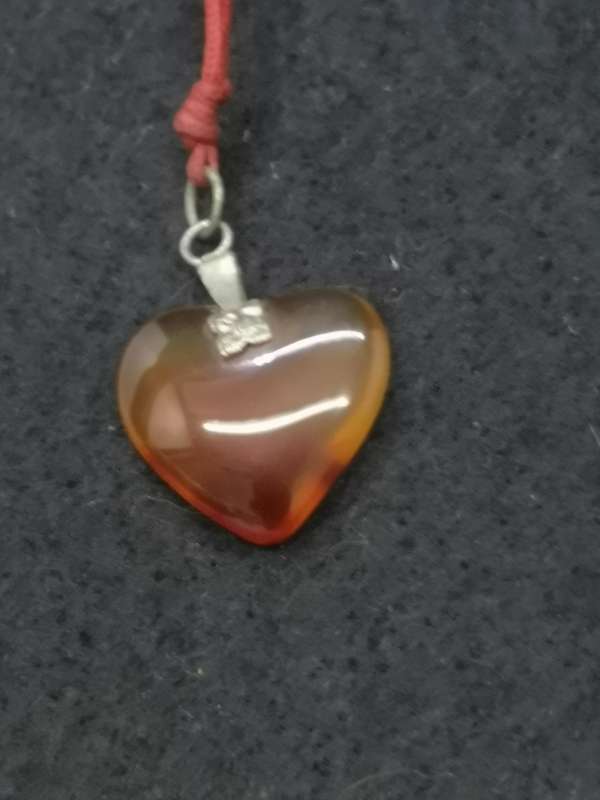 Semi-precious stone heart pendant on a string