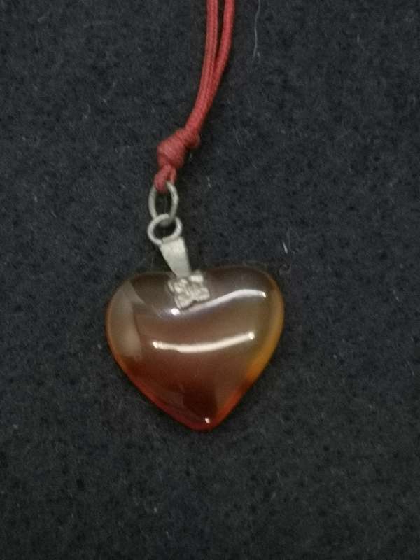 Semi-precious stone heart pendant on a string