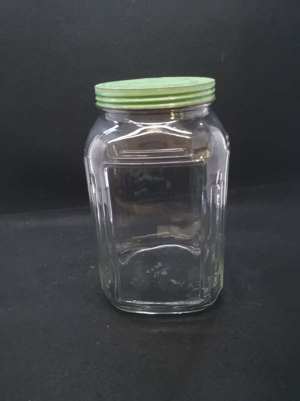 Vintage square bottle with tin lid