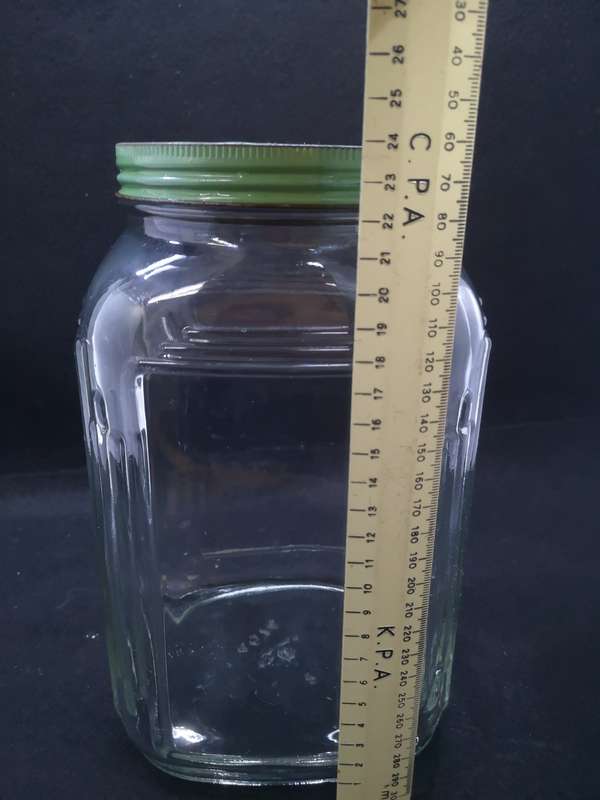 Vintage square bottle with tin lid