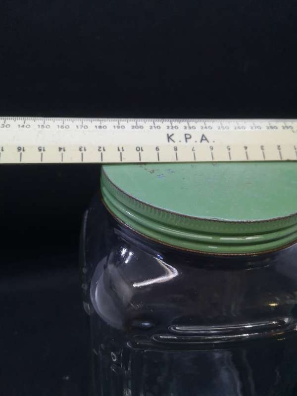 Vintage square bottle with tin lid