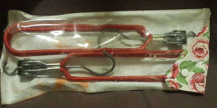 Set of two fold up travel hangers in bag