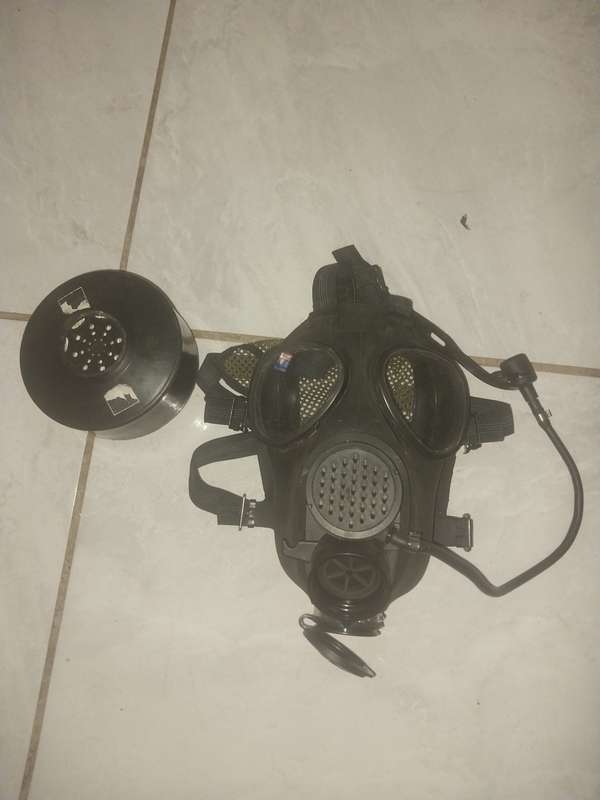 SM-90 SADF gas mask with dark eye lense covers.