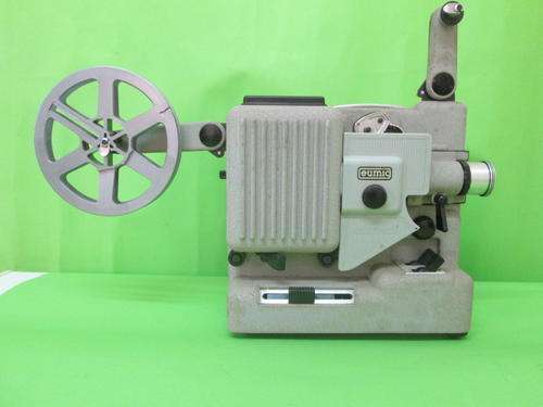 FILM PROJECTOR IN GOOD CONDITION. MIGHT EVEN STILL WORK.