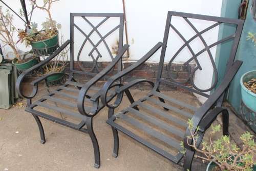 Patio Lot including pair of decorative metal chairs and metal plants stands including all plants