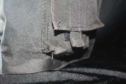 TACTICAL VEST/FLACK JACKET IN ALMOST NEW CONDITION ONE SIZE FITS MOST WITH POUCHES FOR STEEL ARMOUR