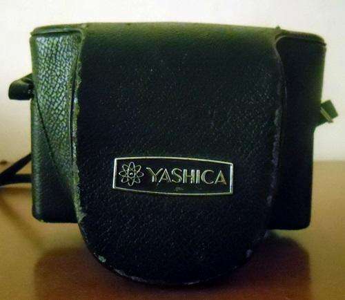 ## Yashica Film camera with pouch (not sure if in working order) ##