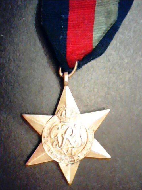 WORLD WAR 11 BRONZE MEDAL WITH RIBBON.
