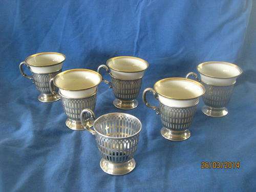 a set of american silver cups holders - beleek and willet