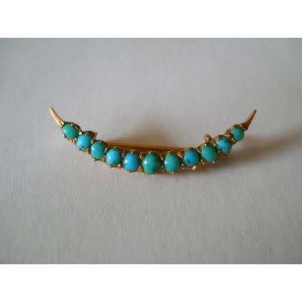 a solid 9/10 ct gold victorian turquoise crescent moon brooch