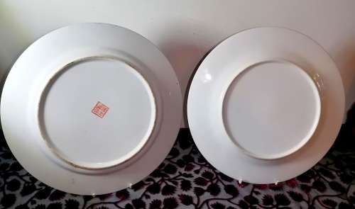 A stunning pair of vintage /antique famille rose plates