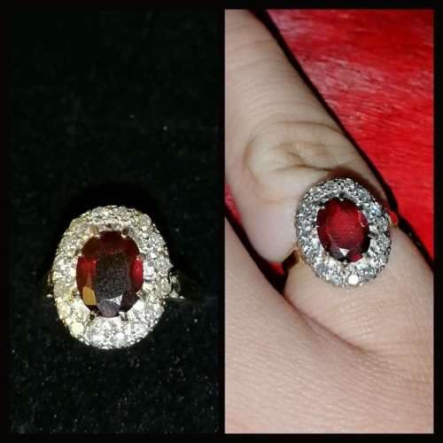 An exceptionally gorgeous deep red garnet and diamond 18ct ring