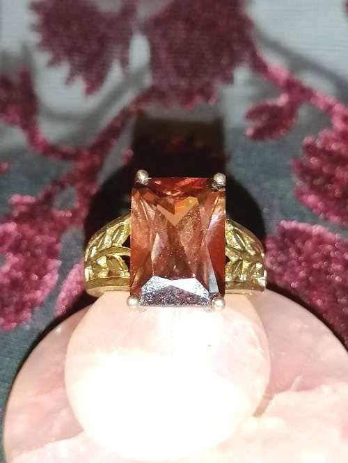 A stunning gilt vermeil silver ring with topaz