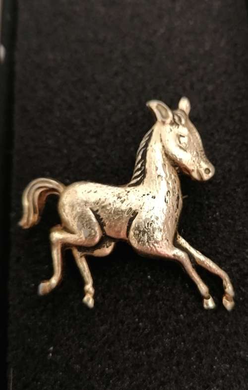 A stunning vintage costume foal brooch