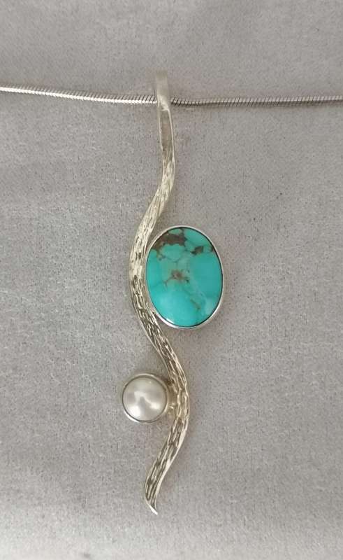 A stunning navajo 950 silver turquoise and mabe pendant