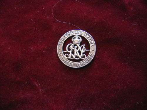 BADGE with Complete Clip at back.