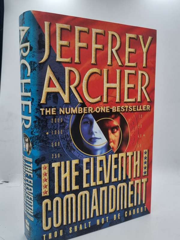 Jeffrey Archer ~ The Eleventh Commandment | Large format hard cover in good condition