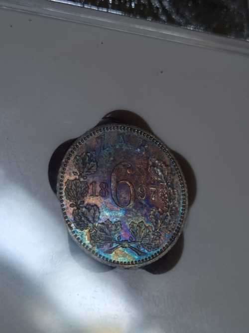 Beautiful, rainbow toned 1897 MS63 6d