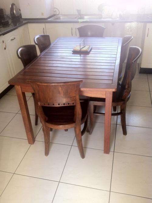 WOODEN TABLE AND 6 MATCHING CHAIRS