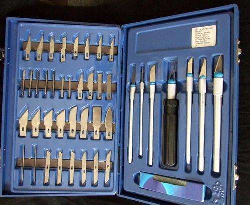 Boxed set of assorted craft knives and blades, with sharpening stone, as new