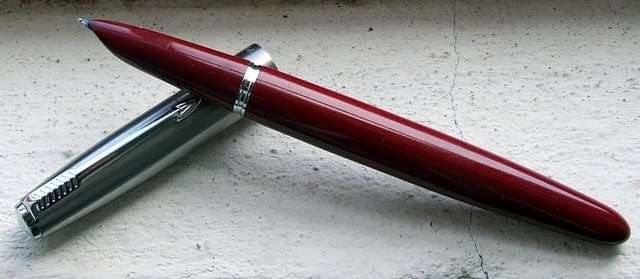 A classic old burgundy PARKER fountain pen in good working condition.