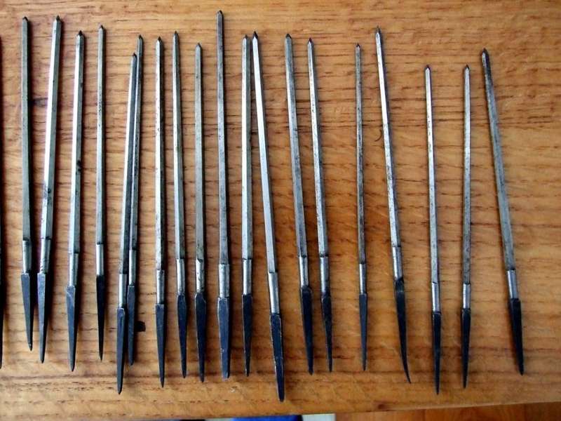 A large collection of assorted engraving tools