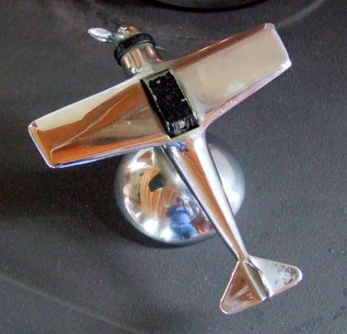 A Vintage Chrome Art Deco petrol table lighter in the stylised shape of an aircraft