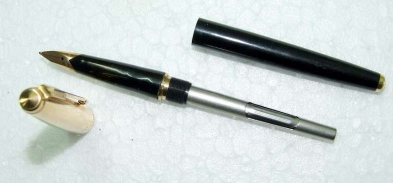 Vintage Boxed Black & Rolled Gold Parker 65 Pen in good working condition.