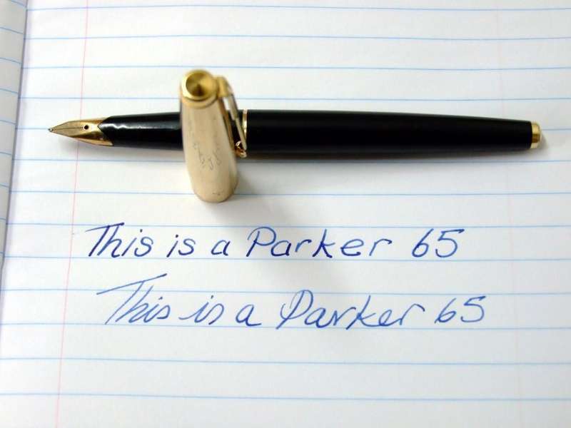 Vintage Boxed Black & Rolled Gold Parker 65 Pen in good working condition.