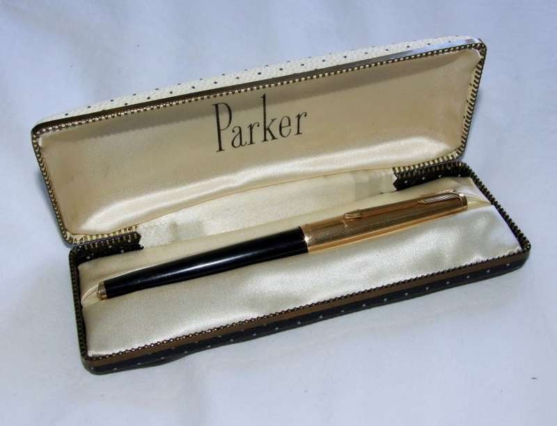 Vintage Boxed Black & Rolled Gold Parker 65 Pen in good working condition.