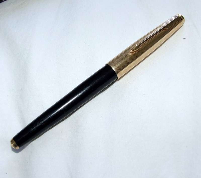 Vintage Boxed Black & Rolled Gold Parker 65 Pen in good working condition.