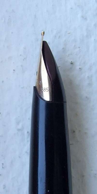 Vintage Boxed Black & Rolled Gold Parker 65 Pen in good working condition.