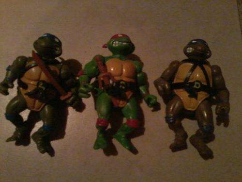 3 teenage mutant ninja turtles about 20 years old good condition for the nostalgic person