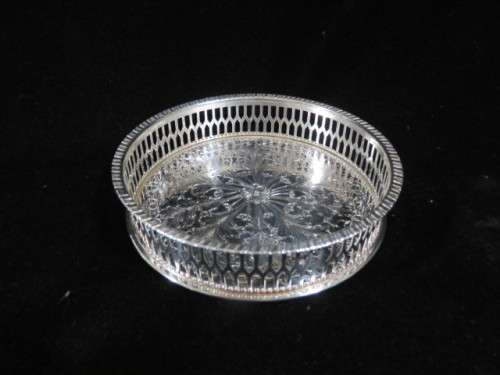 Vintage silver plate wine bottle coaster.