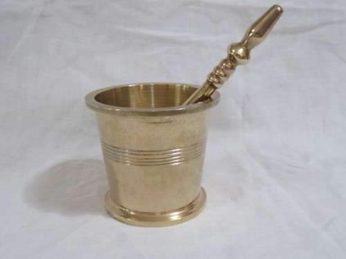 Brass pestle and mortar.