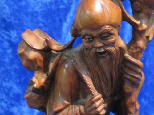 Carved wooden oriental figurine