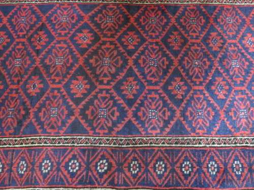 A Persian hand knotted Beluchi rug