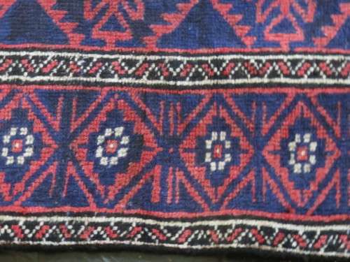 A Persian hand knotted Beluchi rug