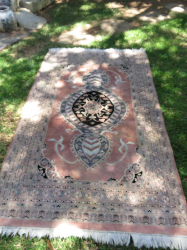 A hand knotted Jaipuri rug