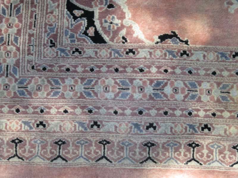 A hand knotted Jaipuri rug