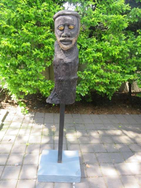 Carved wooden African bust on stand