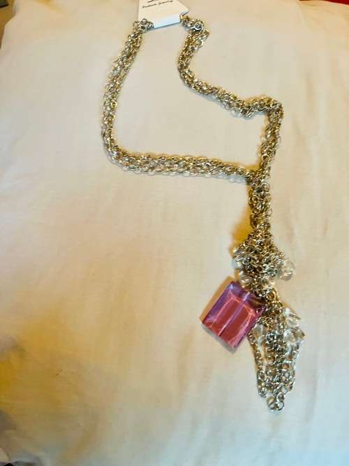 Silver knotted chain with diamanté detail and large purple stone