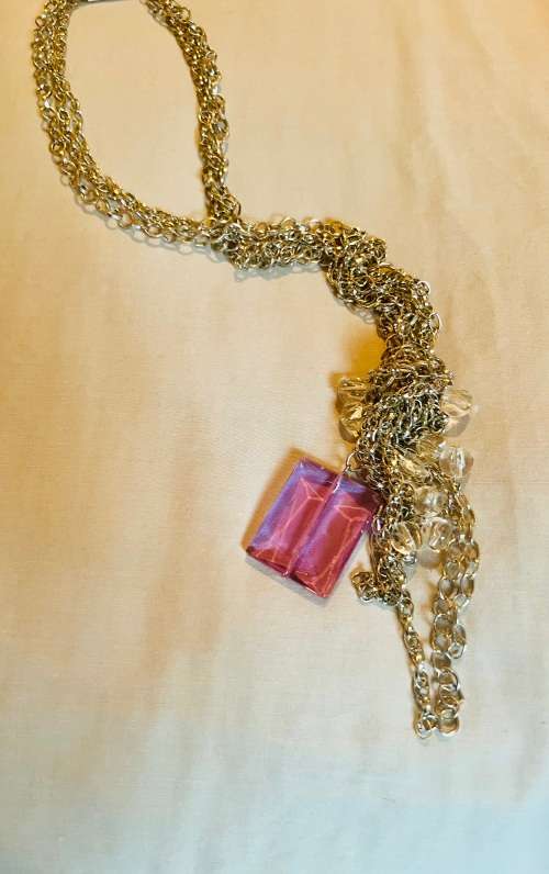 Silver knotted chain with diamanté detail and large purple stone